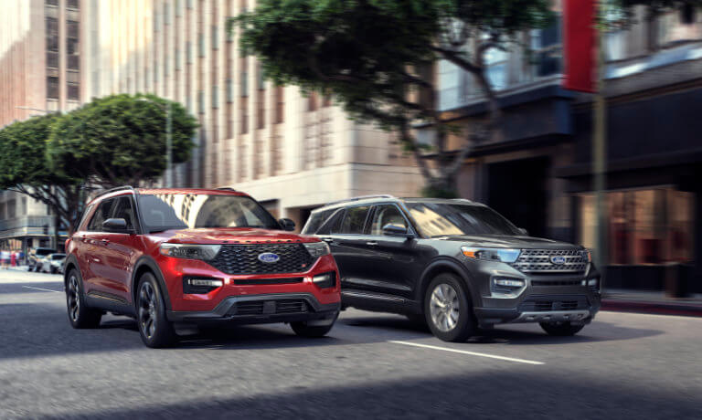 Two 2021 Ford Explorer driving in the city
