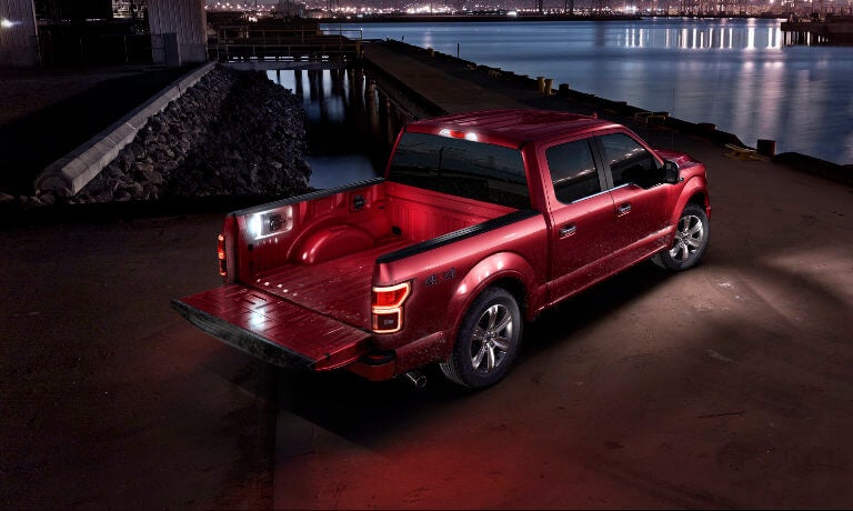 2020 Ford F-150 Magma Red Metalic exterior night on pier