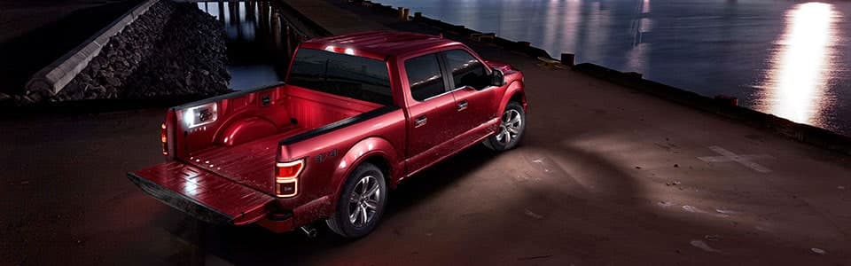 Ford F-150 red exterior by river