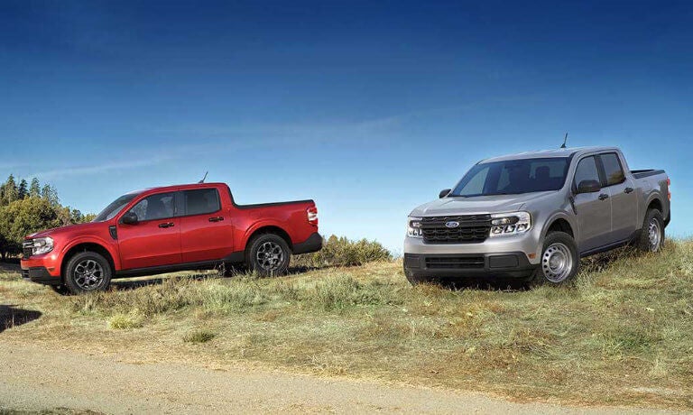 Two 2022 Ford Mavericks parked in the grass
