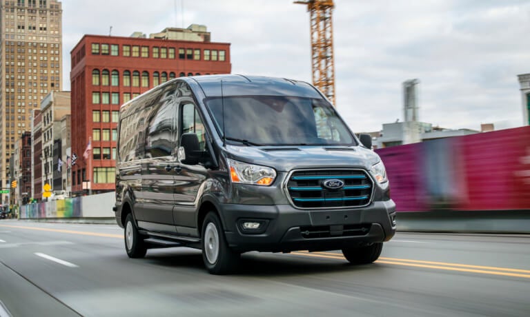 2023 Ford E-Transit driving in the city