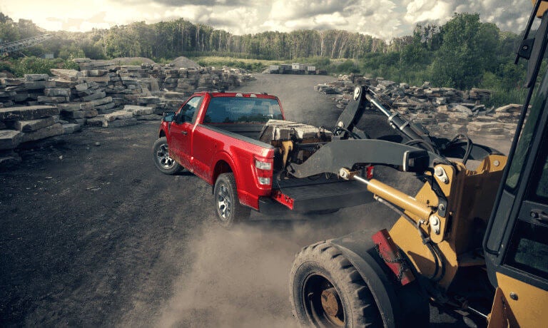 2023 Ford F-150 with rocks being loaded into back