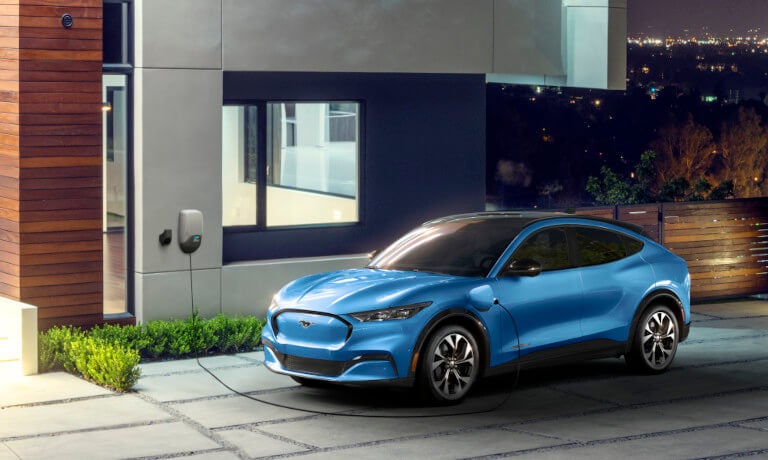 2023 Ford Mustang Mach-E charging at a house