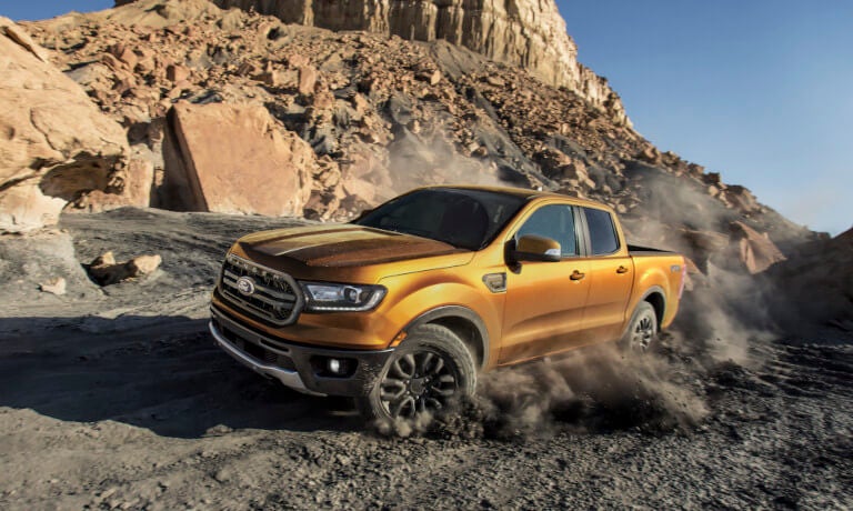 2023 Ford Ranger kicking up dirt in mountains