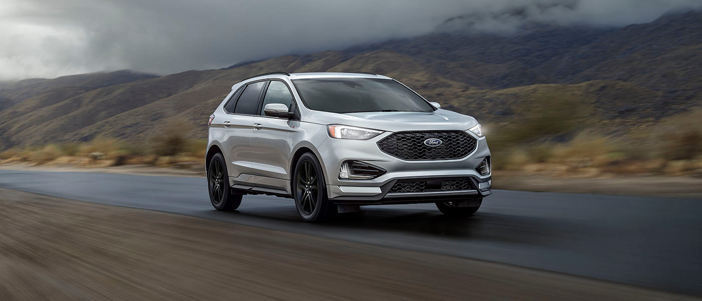 2024 Ford Edge driving under stormy skies