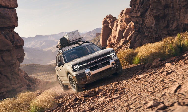 2025 Ford Bronco Sport driving with luggage on rocky path