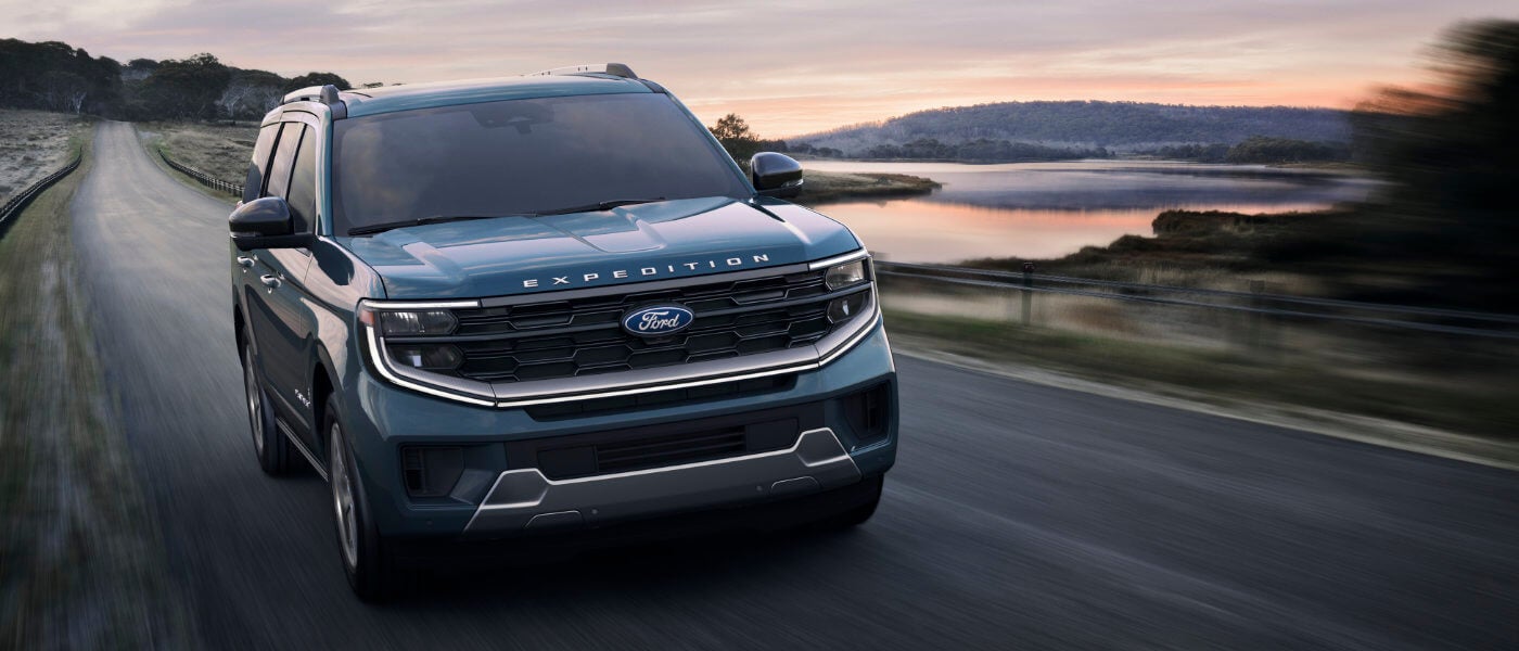 2025 Ford Expedition driving on lakeside road
