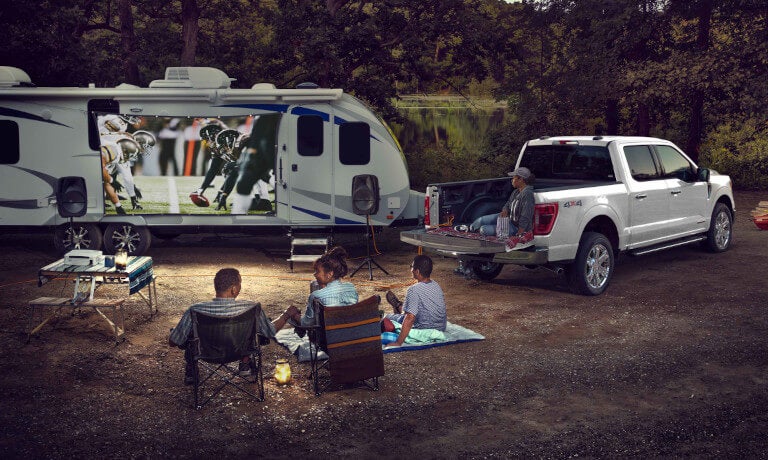 2025 Ford F-150 parked with an RV watching football
