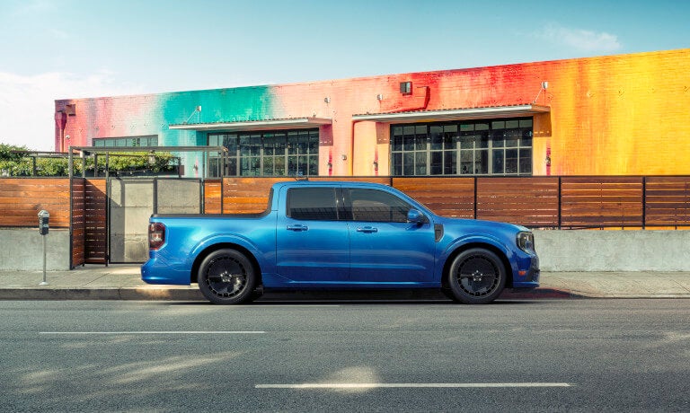 2025 Ford Maverick side view by rainbow wall