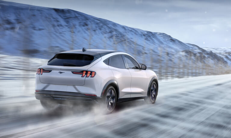 2025 Ford Mustang Mach-E driving in snow