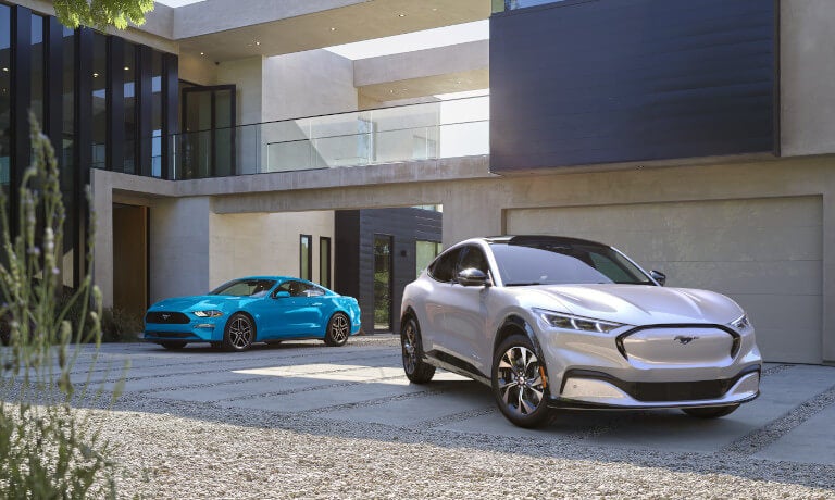 2025 Ford Mustang Mach-E pair parked in driveway