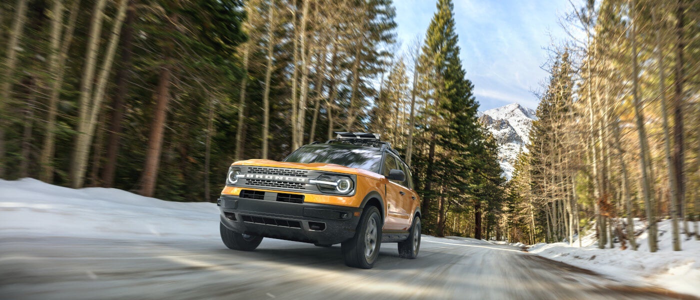 2026 Ford Bronco driving in snowy mountains