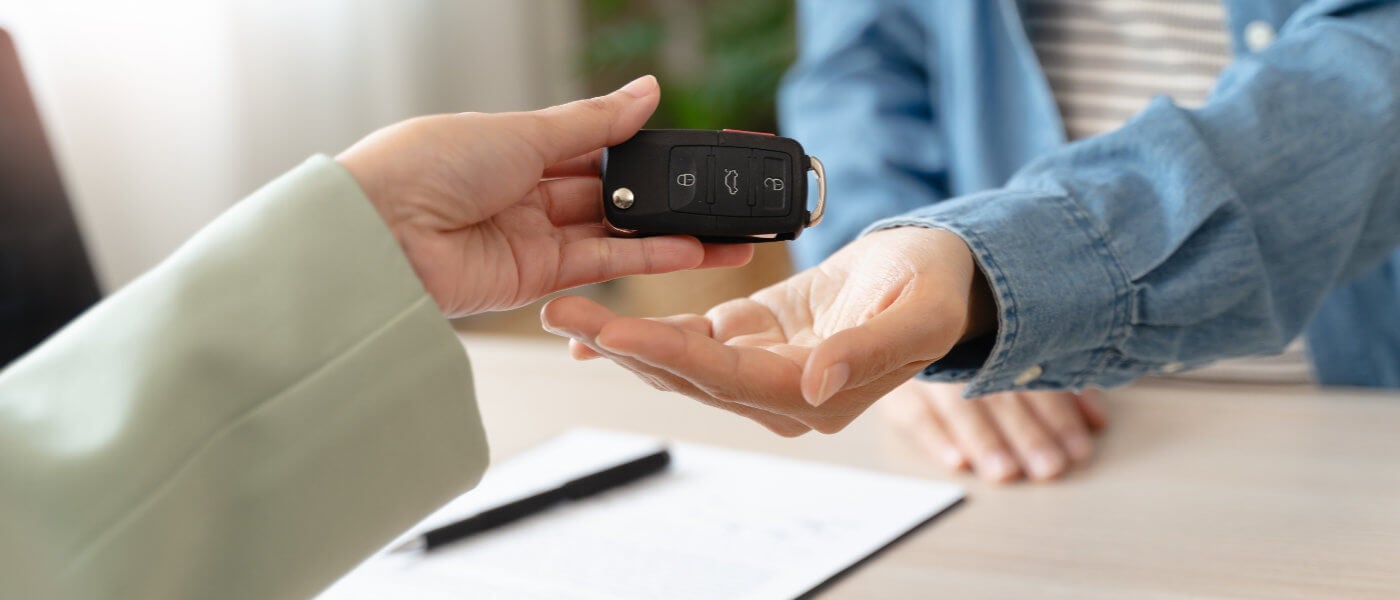 Ford Salesman handing over car keys