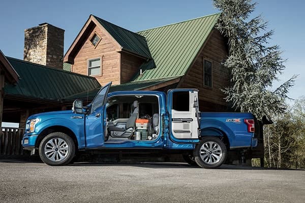 Ford F-150 interior features outside house