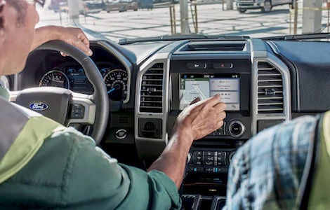 Two construction workers using the SYNC System in the Ford F-150